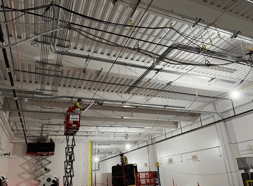 Modern hospital complex with ongoing construction activity