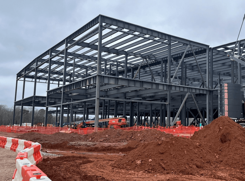 Cost estimators analyzing project dashboards in a modern office