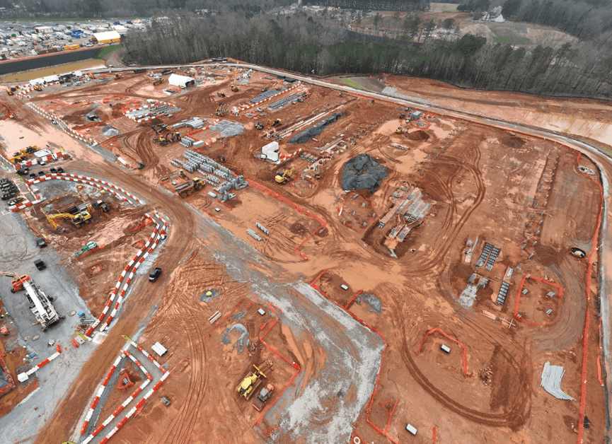 Risk management team collaborating over analytics and charts